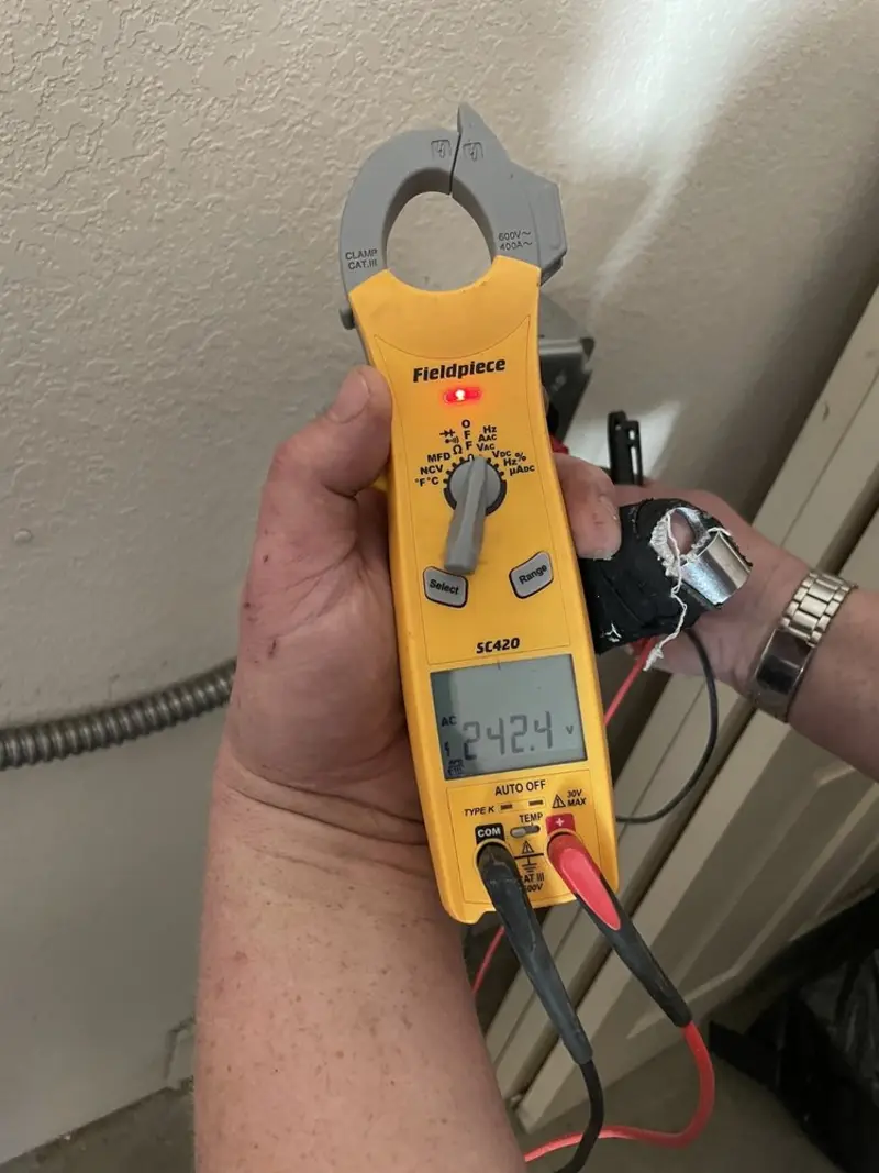Voltage testing with clamp meter during Generator Installation in Citrus Park